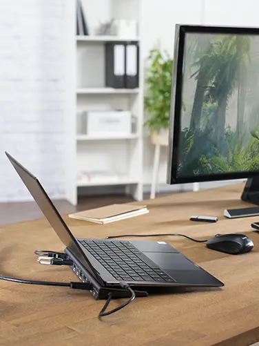 Laptop is connected to the charging station.