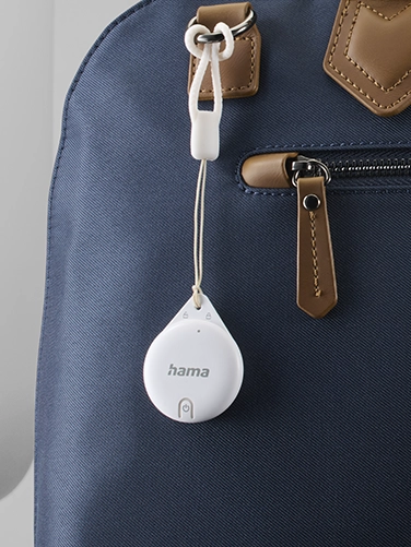 The Hama Key Finder, Item Finder for Apple "Where is" app is attached to a handbag